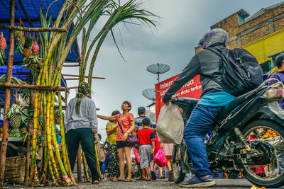 Group of people against built structure