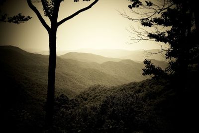 Scenic view of silhouette mountains against sky