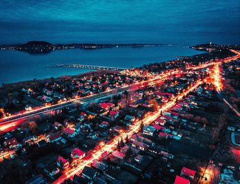 High angle view of illuminated buildings in city at night