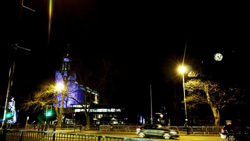 Illuminated street light at night