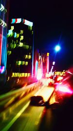 Blurred motion of vehicles on road at night
