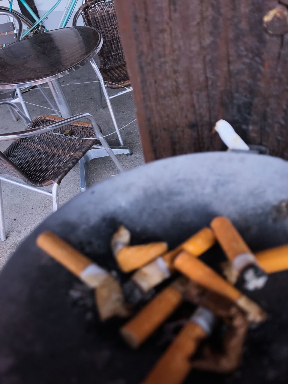 HIGH ANGLE VIEW OF SMOKING ON FLOOR