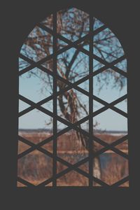 Close-up of glass window against building