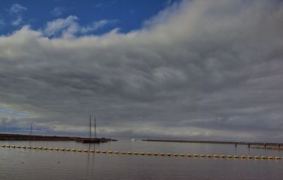 View of calm sea against cloudy sky