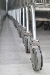 Close-up of bicycle parked on footpath