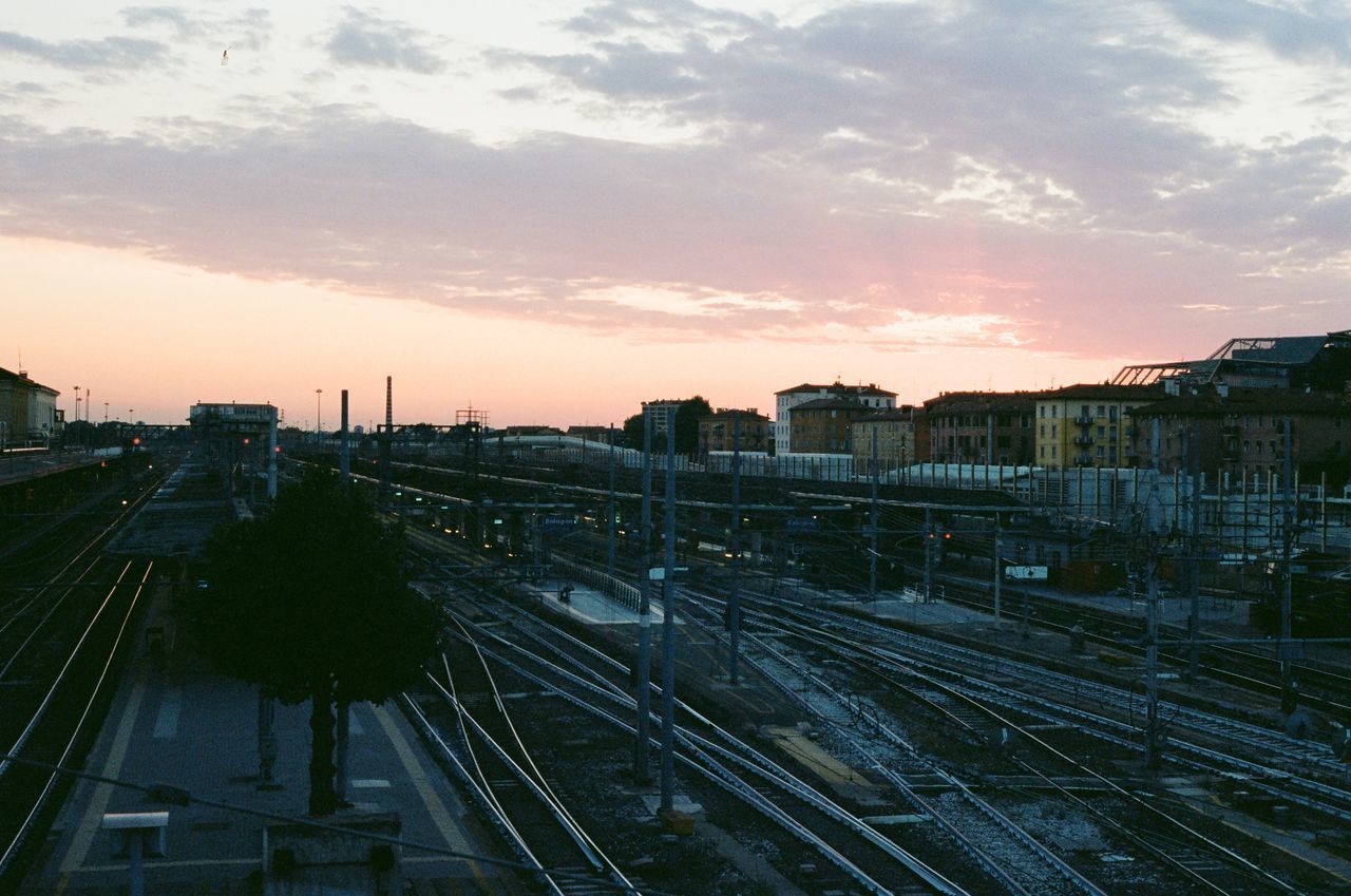 HIGH ANGLE VIEW OF RAILROAD TRACKS AGAINST SKY