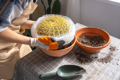 Cropped hand of man preparing food