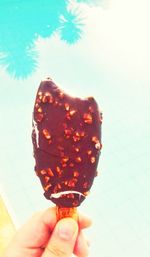 Cropped hand holding ice cream