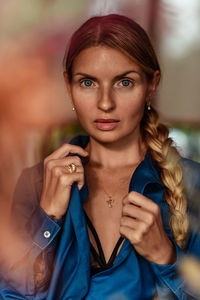 Blonde woman with blue eyes portrait