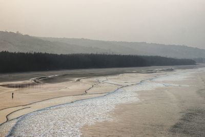 Scenic view of land against sky during winter