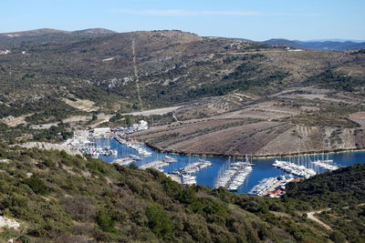 High angle view of bridge and mountains against sky