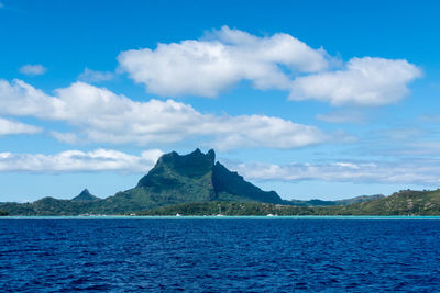 Scenic view of sea against blue sky