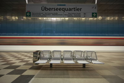 Empty seats at railroad station platform