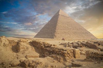 View the giza pyramid against beautiful sunset sky