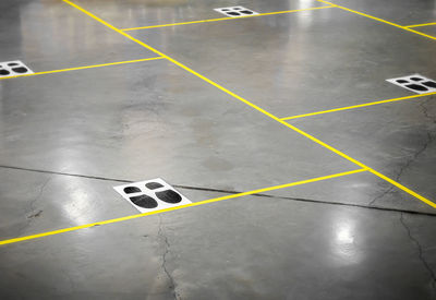 High angle view of arrow sign on road