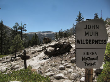 Information sign against clear blue sky at sierra national forest