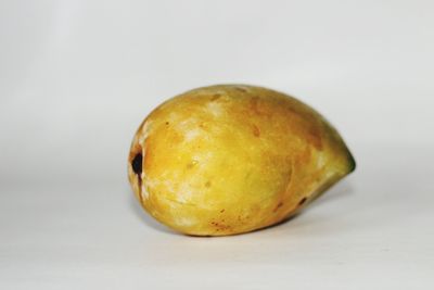 Close-up of fruits against white background