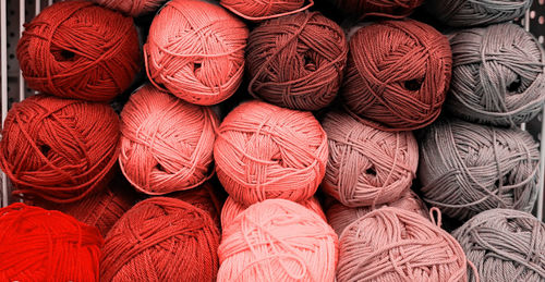 Yarn balls wool in fabric shop. background from colored acrylic yarn. skeins of thread close-up. 