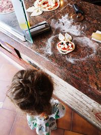 High angle view of woman preparing food at home