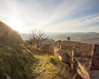 High angle view of houses and buildings against sky