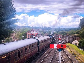 Train on railroad tracks against sky