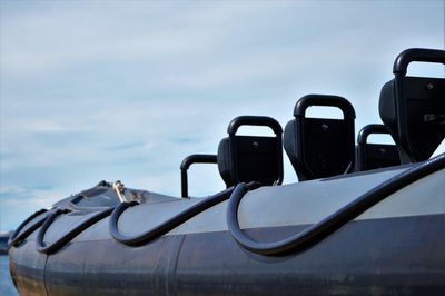 Close-up of ship in sea against sky