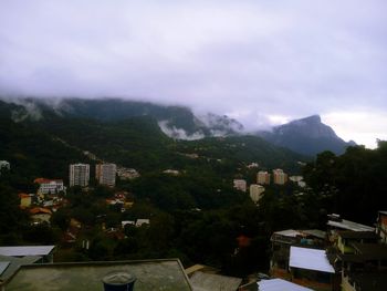 Scenic view of residential district against sky