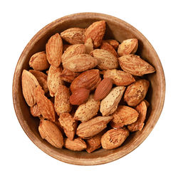 Close-up of chocolate in bowl against white background