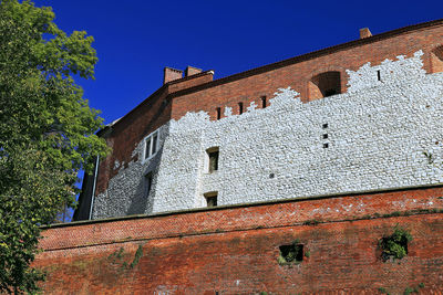 Low angle view of old building against sky