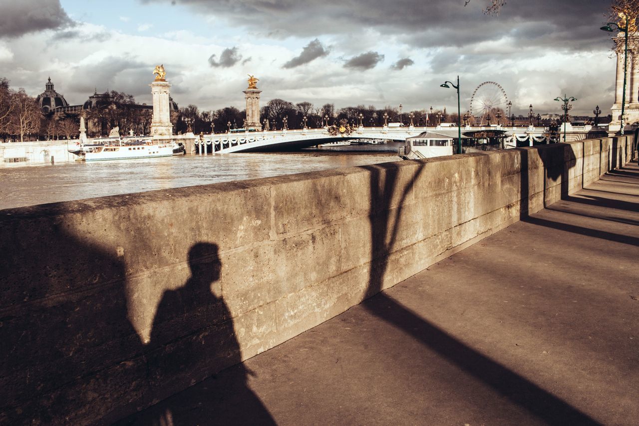 SHADOW OF MAN ON STREET