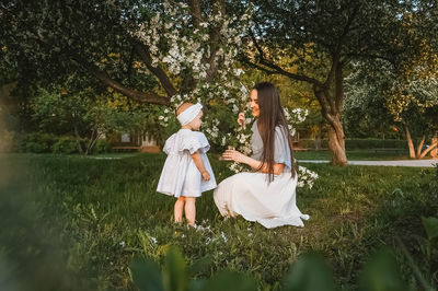 Full length of woman standing on field