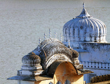 High angle view of old temple by lake