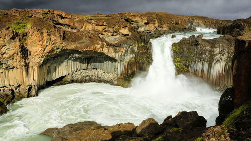 Scenic view of waterfall on iceland 