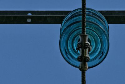 Low angle view of pole against clear blue sky
