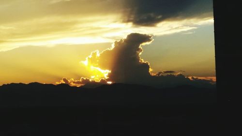 Scenic view of mountains at sunset