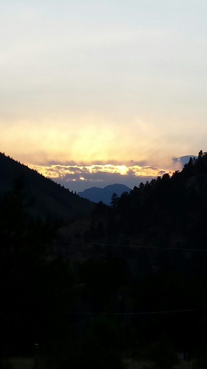 sunset, silhouette, sky, tranquil scene, scenics, tranquility, beauty in nature, orange color, landscape, nature, mountain, cloud - sky, idyllic, dark, outdoors, no people, non-urban scene, cloud, growth