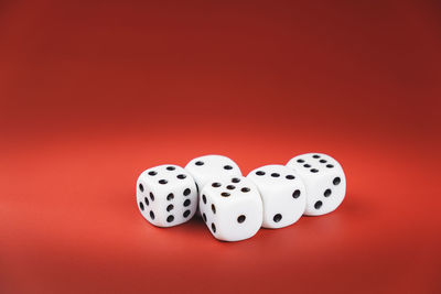 High angle view of eyeglasses against red background