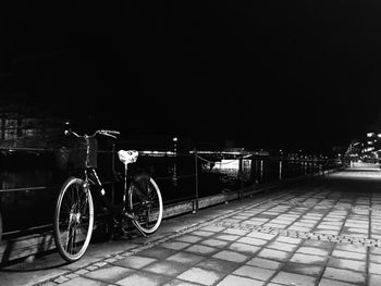 Cars parked on road at night