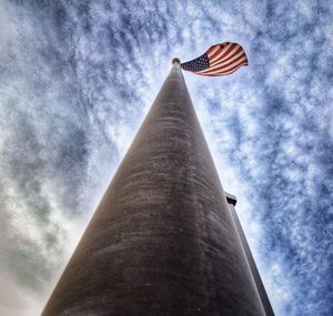 Low angle view of building against cloudy sky