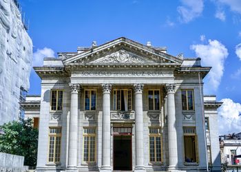 Low angle view of building against blue sky