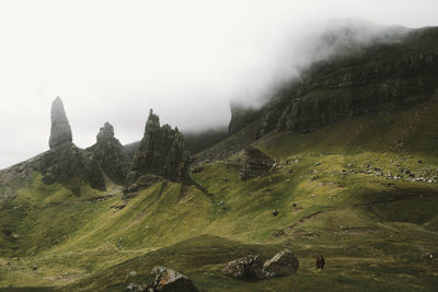 Scenic view of scottish highlands in foggy weather