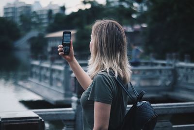 Midsection of woman photographing