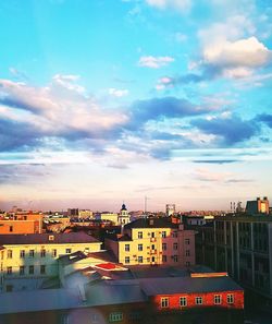 View of town against sky during sunset