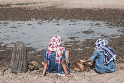 Rear view of people on beach