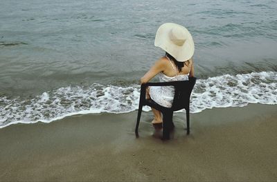 Woman relaxing on shore