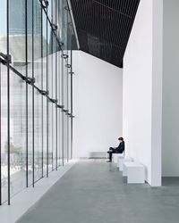 Man sitting in modern building
