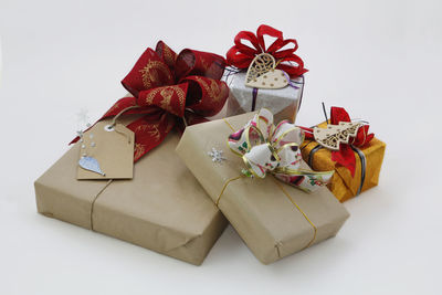 Close-up of red roses in box against white background
