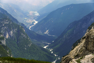 High angle view of valley and mountains against sky