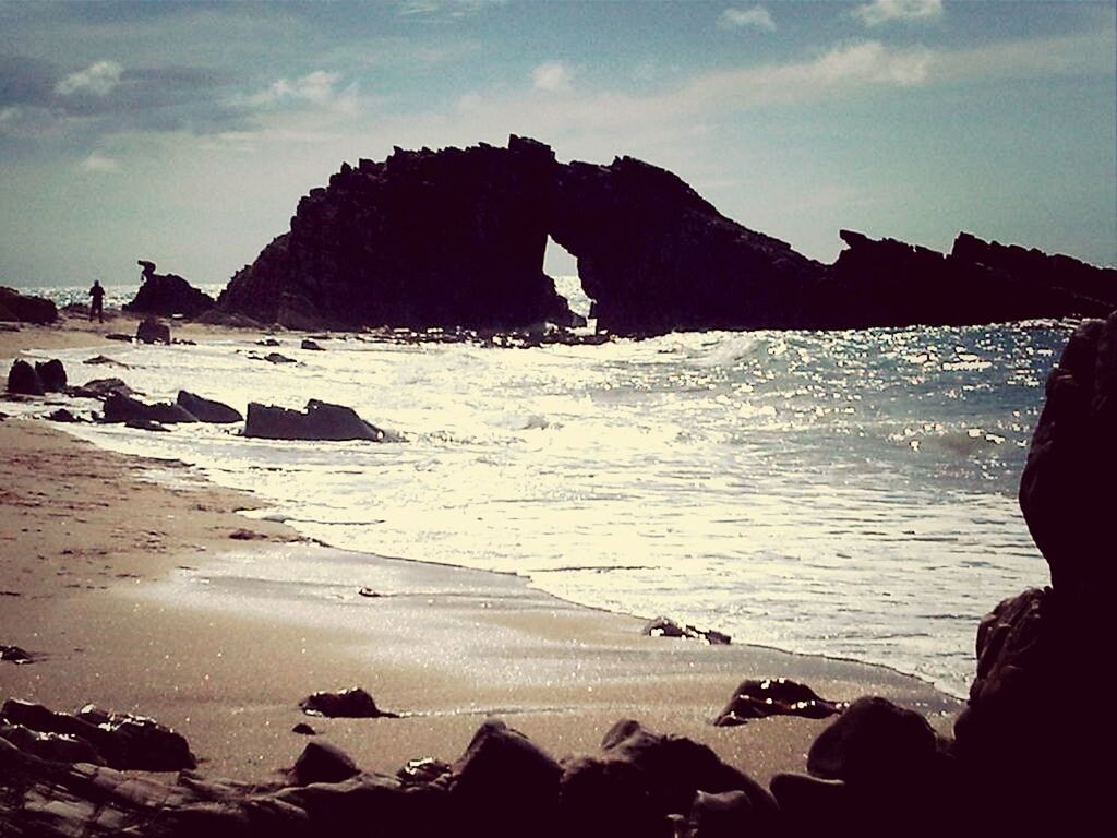 sea, beach, water, sky, shore, scenics, tranquil scene, tranquility, beauty in nature, rock - object, horizon over water, sand, rock formation, nature, mountain, coastline, vacations, cloud - sky, leisure activity