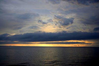 Scenic view of sea against sky at sunset